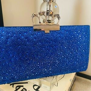 Alexander McQueen Blue. Skull Four Ring Embellished Clutch Bag